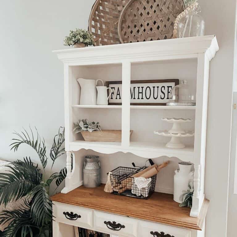 Hallway With a Cabinet in White-and-Wooden Accents