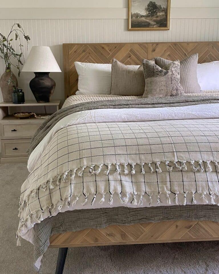 Herringbone Bed Against Beadboard Wall