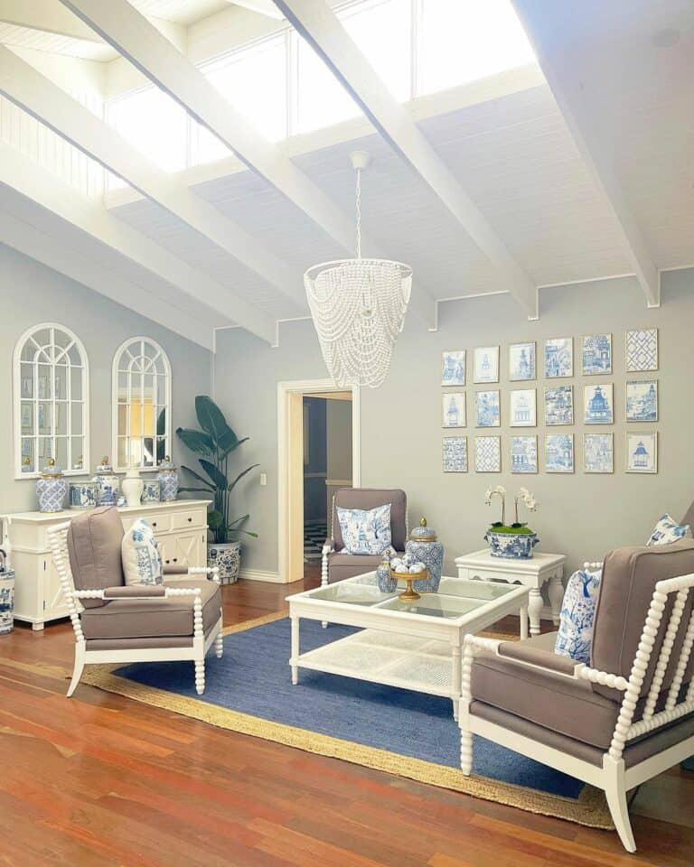 High Ceiling Living Room With White Chandelier