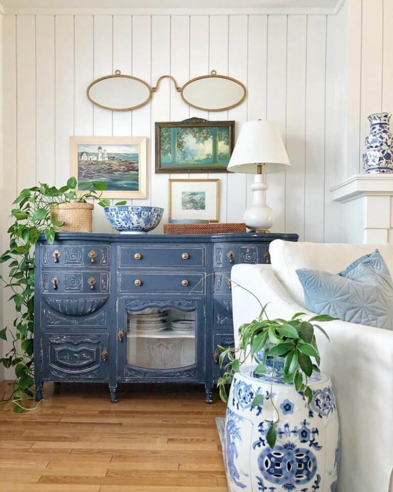 Large Gold Spectacles and a Rustic Navy Blue Cabinet