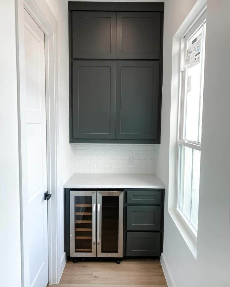 Monochrome Pantry With Black Cabinets