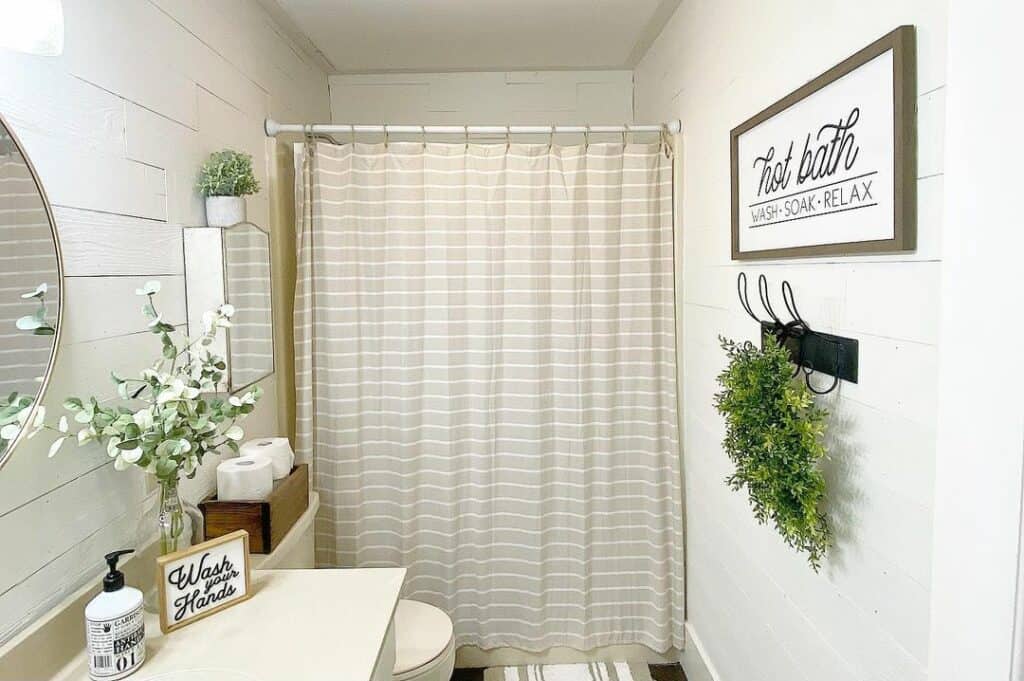 Neutral Accessories in a Shiplap Bathroom