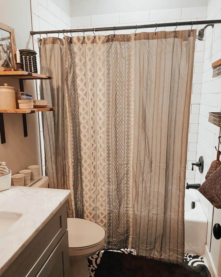 Neutral Bathroom With Patterned Shower Curtain