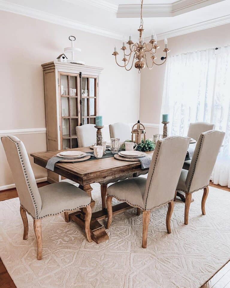 Neutral Dining Room With a White Birdhouse