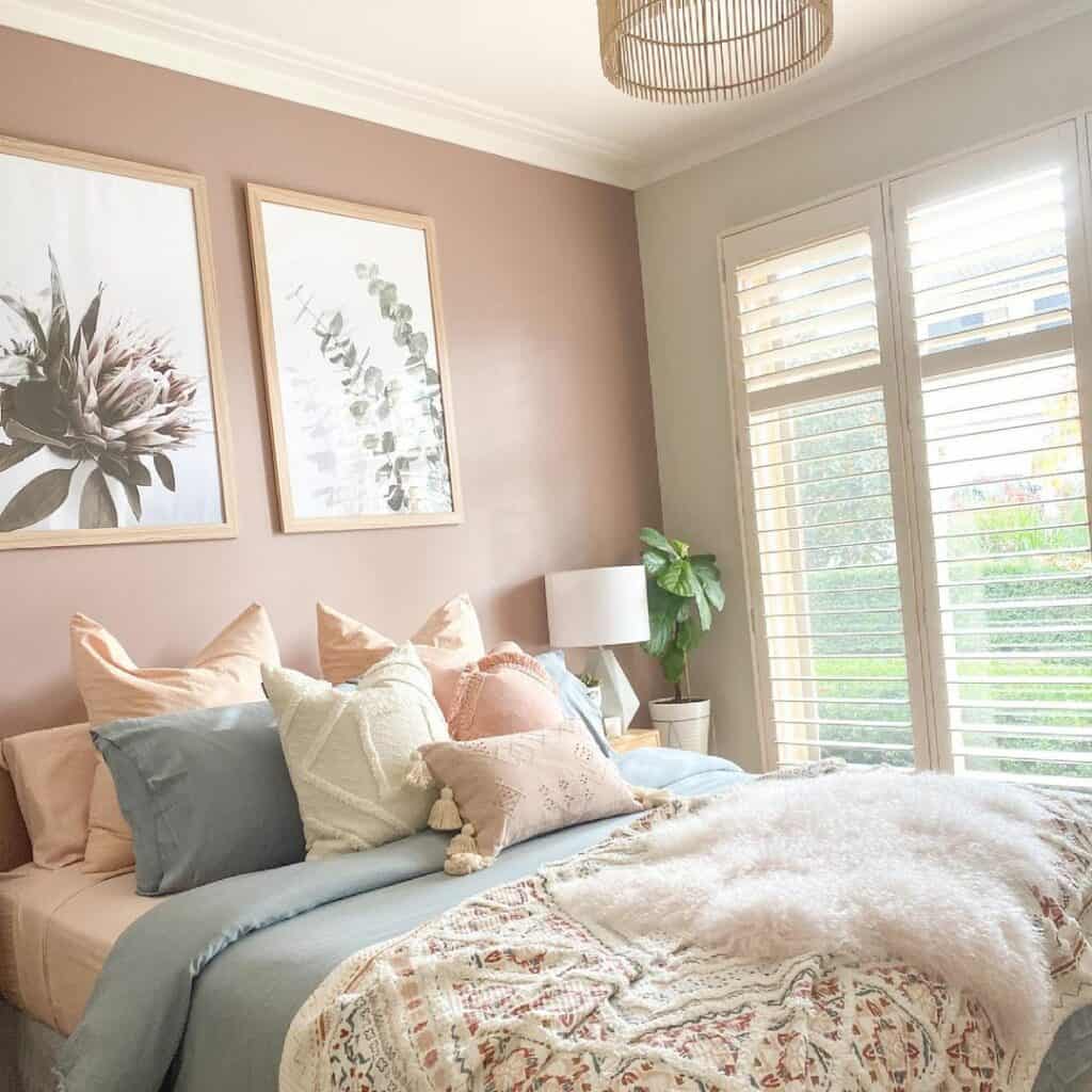 Pale Pink Accent Wall and Floral Artwork