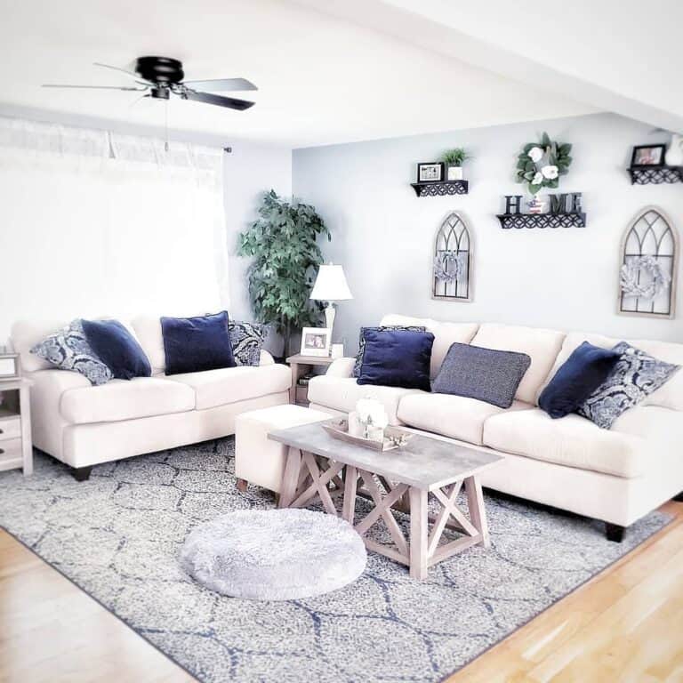 Pearly White Sofa and Blue Pillows in Living Room