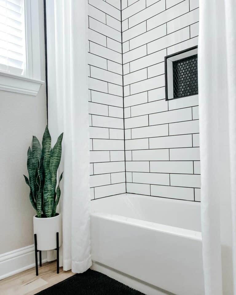 Penny Tile Niche Accentuated by White Subway Tile