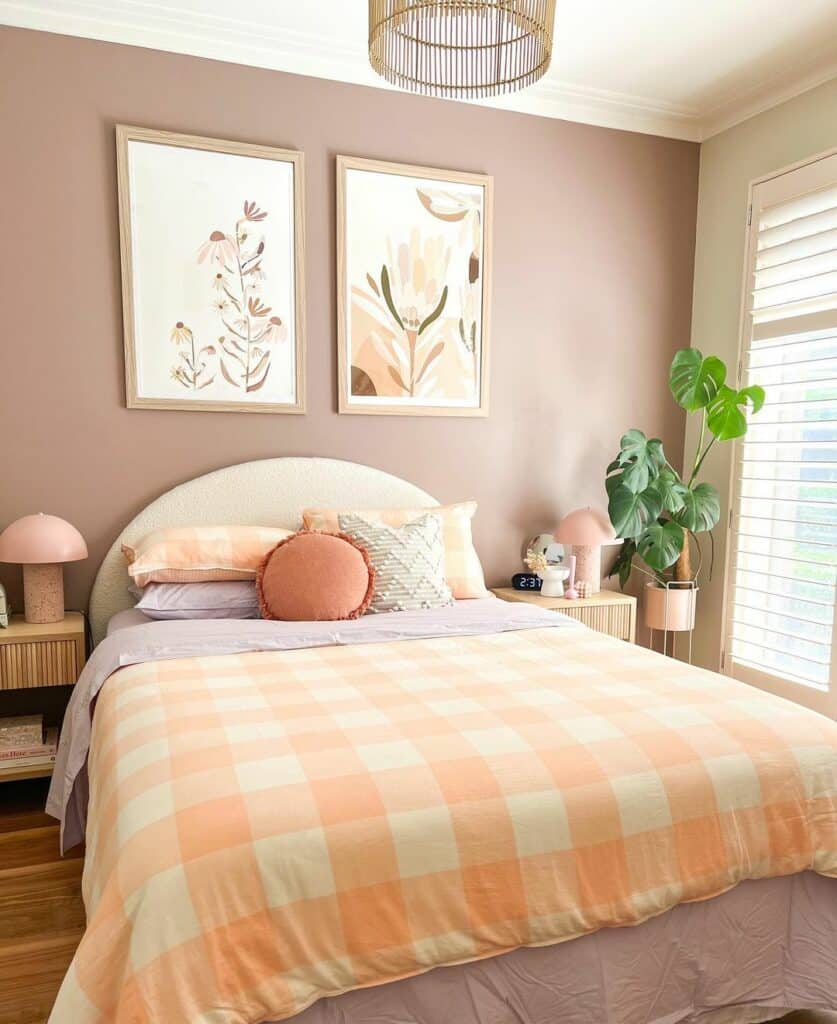 Pink Bedroom With Wood Frame Artwork Above Bed