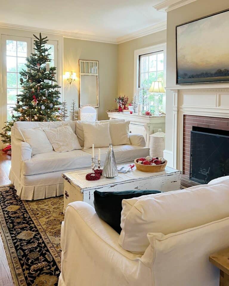 Quaint Living Area With Two Matching White Vintage Sofas