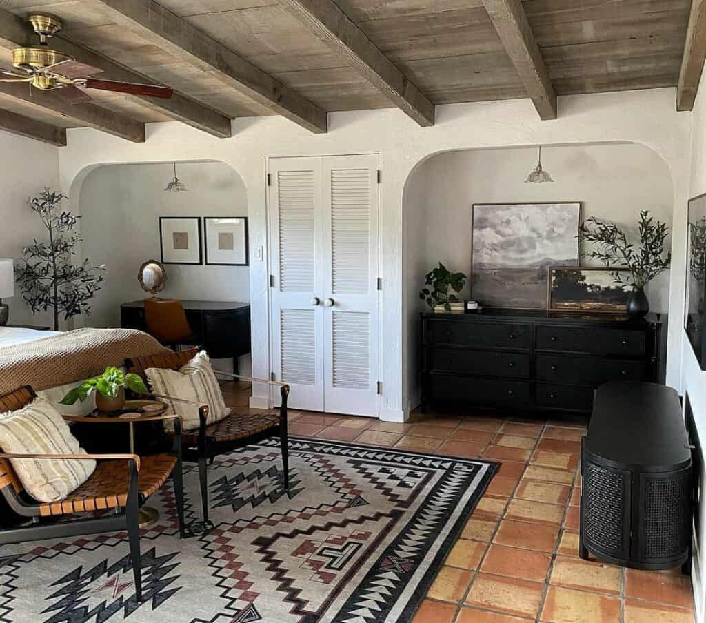 Rustic Bedroom With a Centered Tribal Area Rug