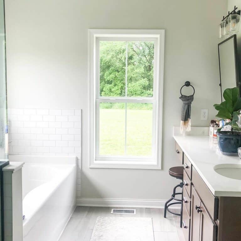 Small Bathroom With White Frame Window