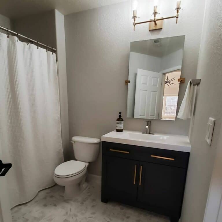 Small Simple Bathroom With Black Cabinet Vanity