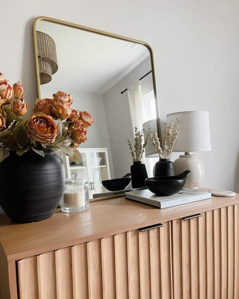 Using Black Vases Along a Modern Wood Hutch