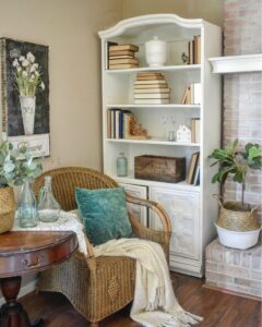 Vintage White Wood Bookcase by a Rustic Brick Fireplace