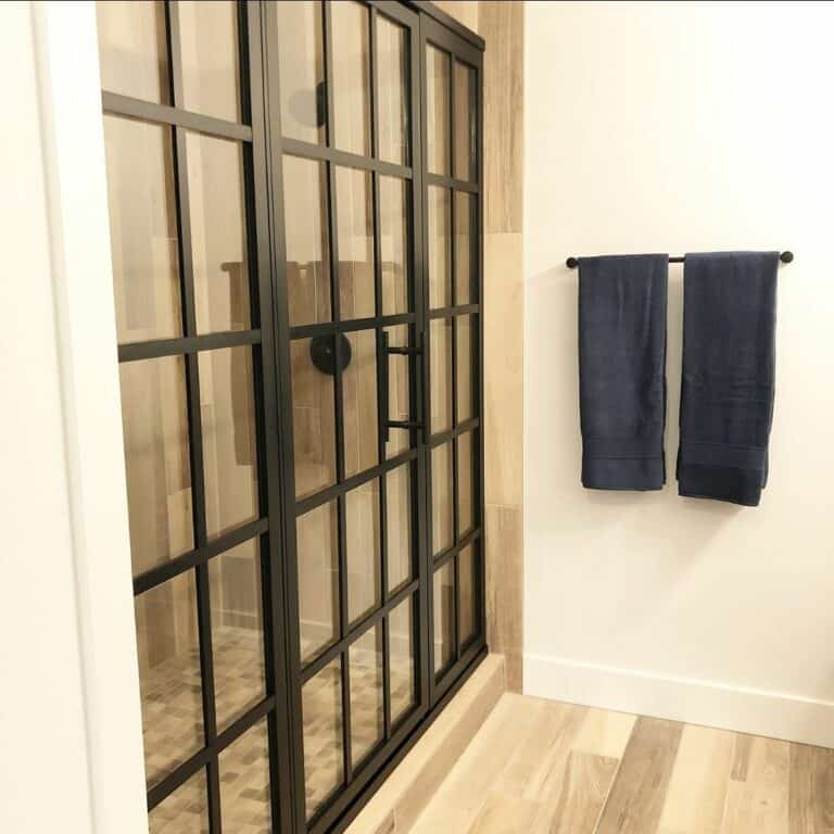 Walk-in Shower With Black-accented Glass Doors