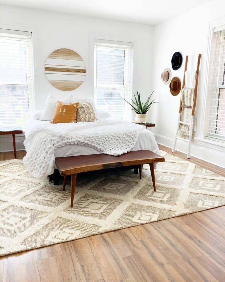 Warm Wood Bedroom Floors With a Large Neutral Area Rug