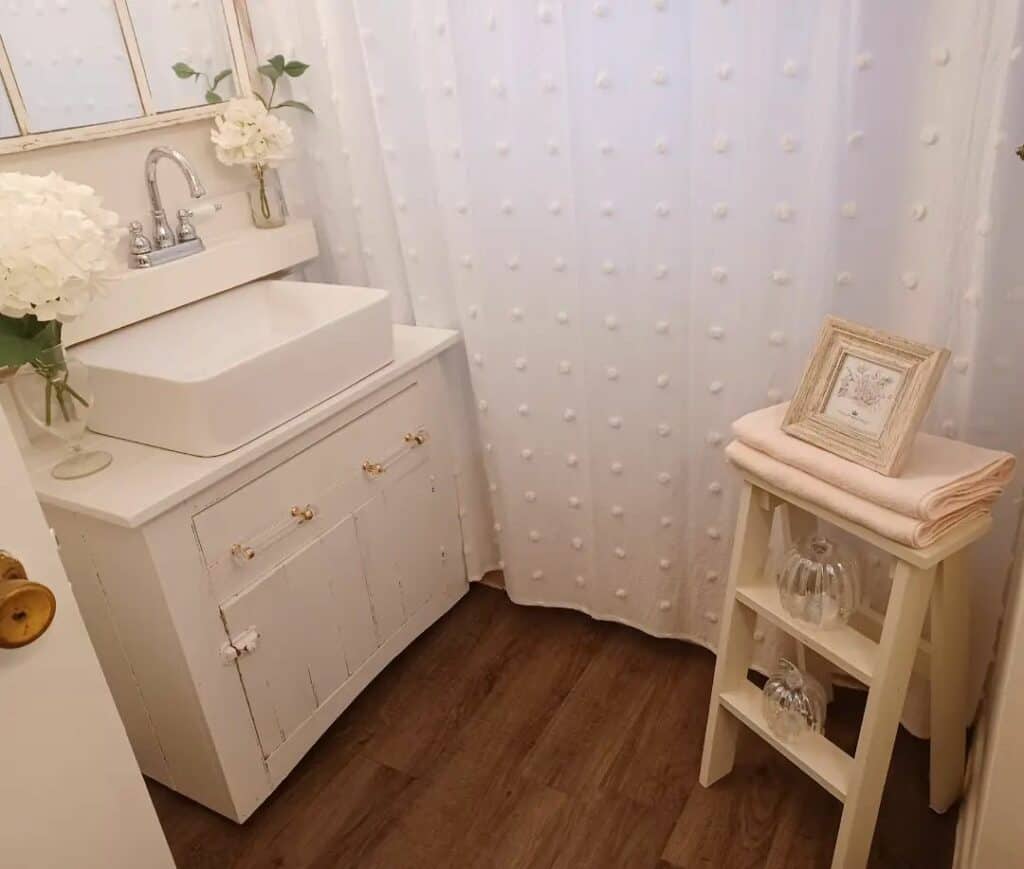 White Bathroom With Textured Shower Curtain