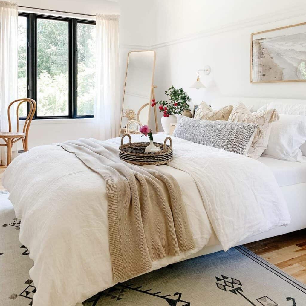 White Bed With Beige Bedding