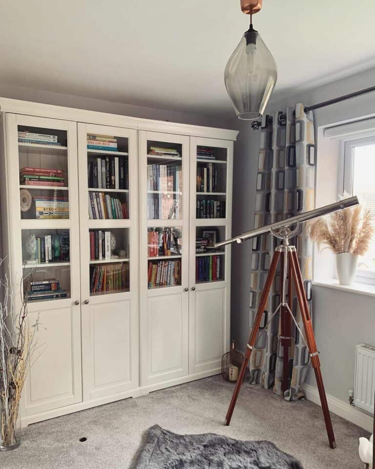 White Bookcase With Glass Paneled Doors and Cabinets
