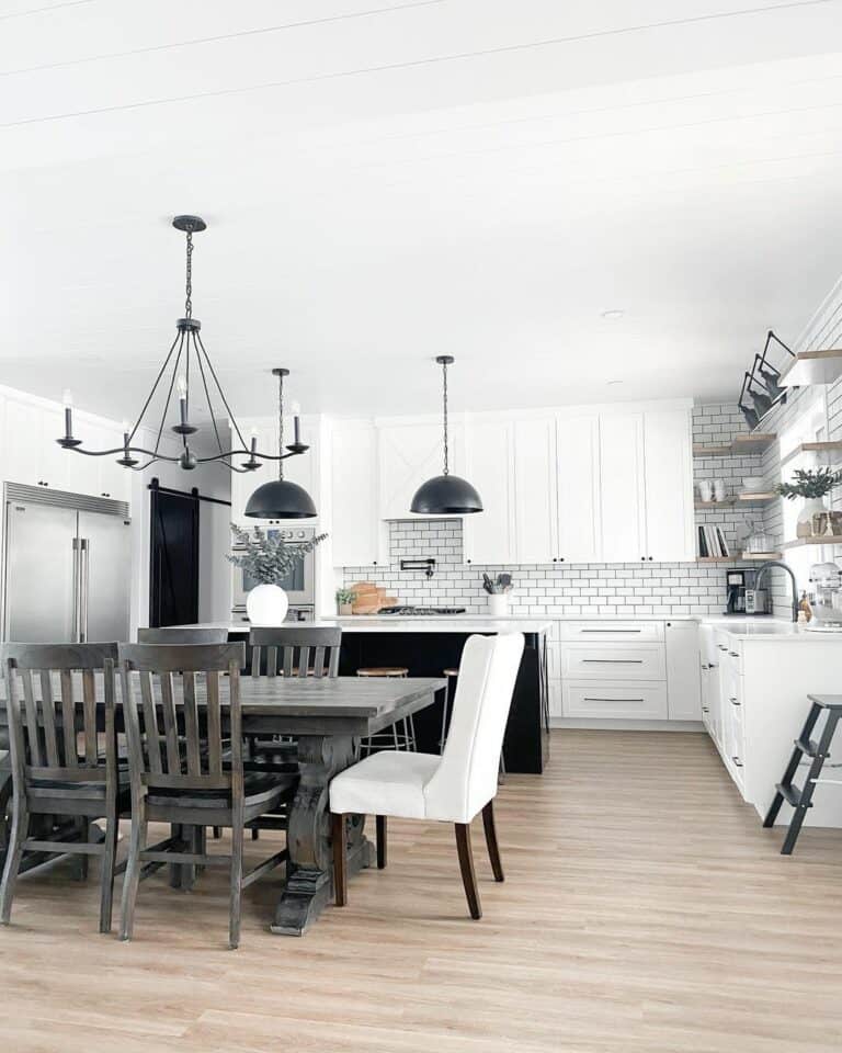 White Kitchen With Black Pendant Lights and Hardware