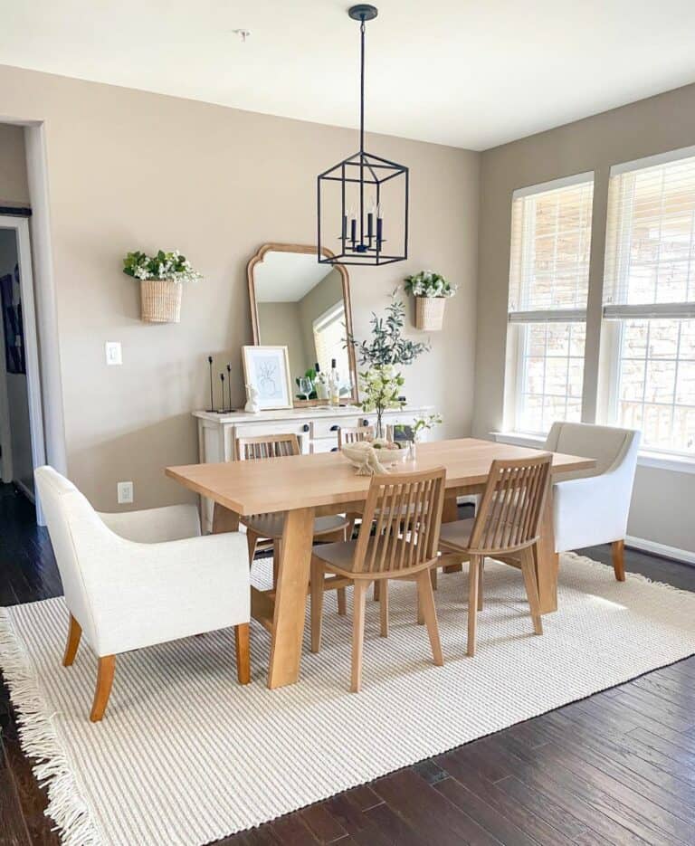 White Sideboard Stands Beside Wood Dining Table