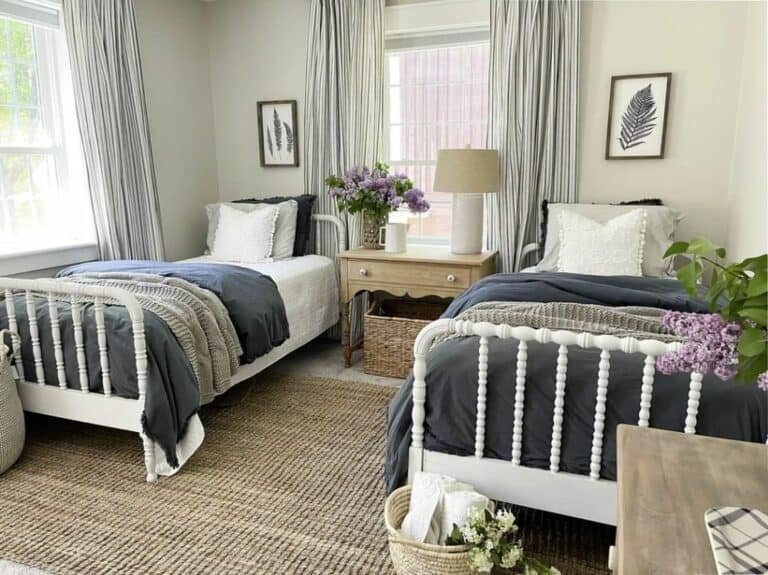 White Spindle Beds on a Woven Rug