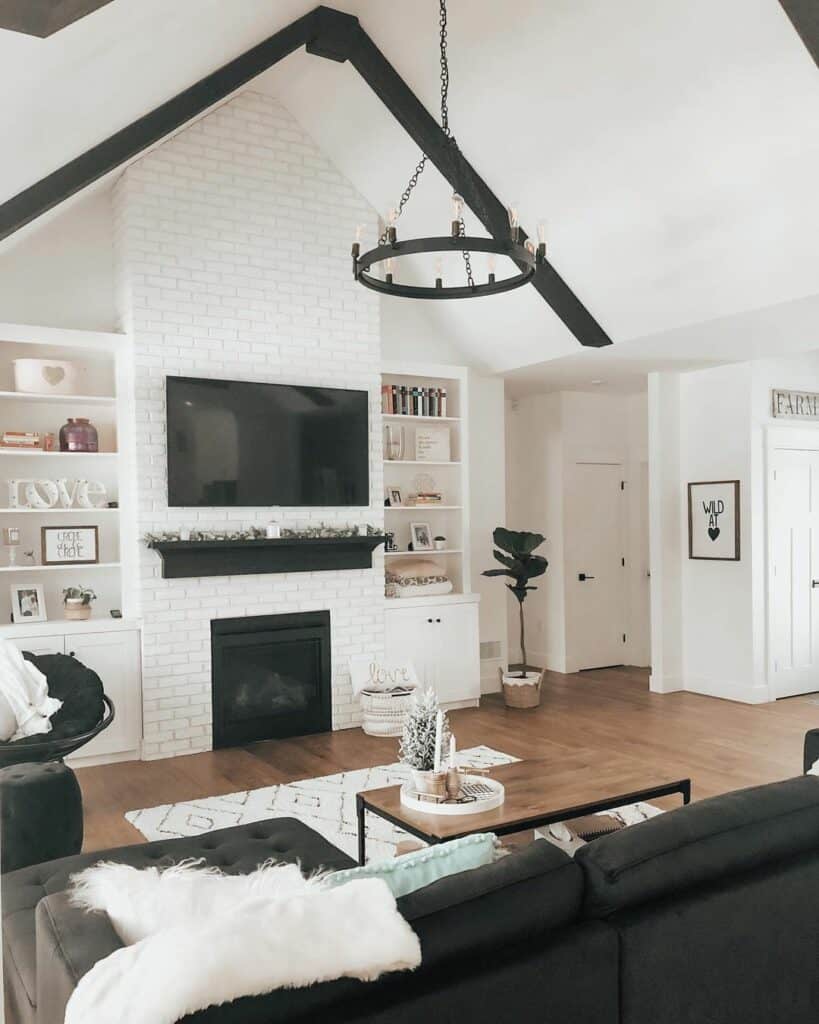 White Vaulted Living Room Ceiling With Black Exposed Beams