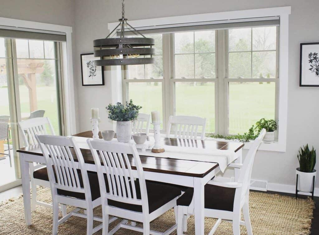 White-and-Black Wooden Dining Set With Potted Plants