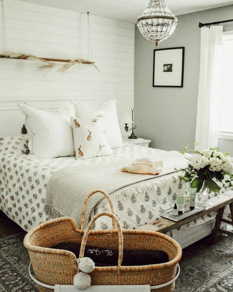 White and Gray Bedroom With Wicker Moses Basket