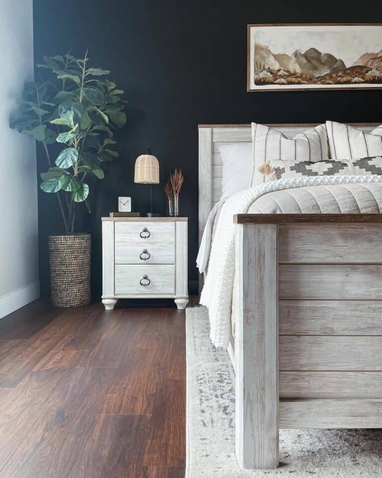 Wood Frame Artwork Above Whitewashed Wood Bed