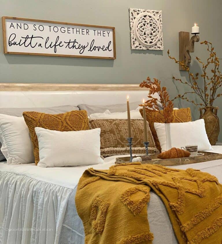 Wood-framed Wall Sign Above Bohemian Bed