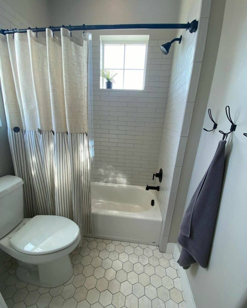 Hexagon Flooring Surrounds an Alcove Bathtub