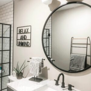 Modern Farmhouse Bathroom With Circular Mirror