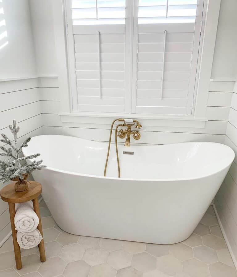 All White Bathroom With Stone Colored Hexagonal Floor Tiles