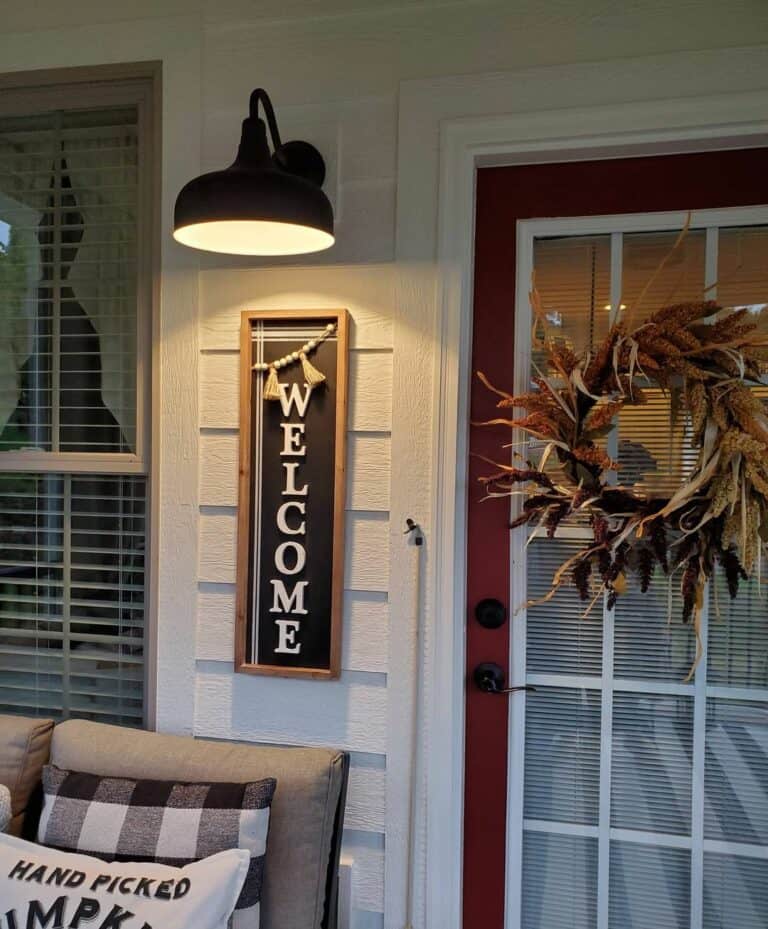 Back Porch With Black Welcome Sign