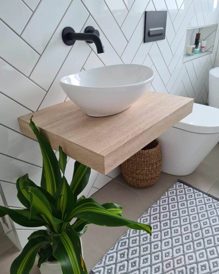 Bathroom With White Herringbone Tile