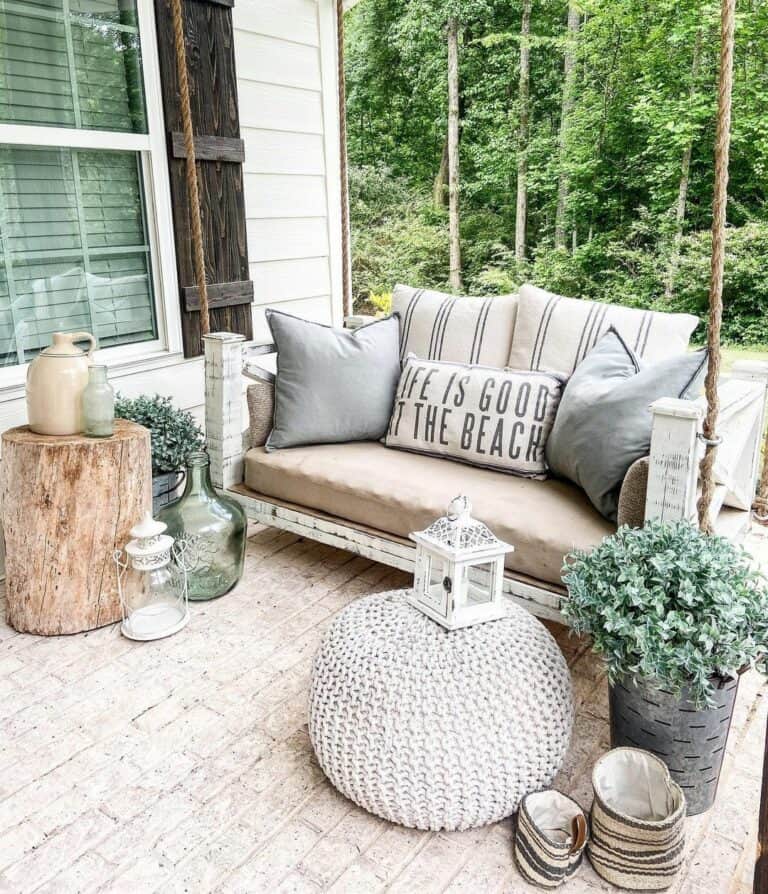 Beachy Patio With White Porch Swing