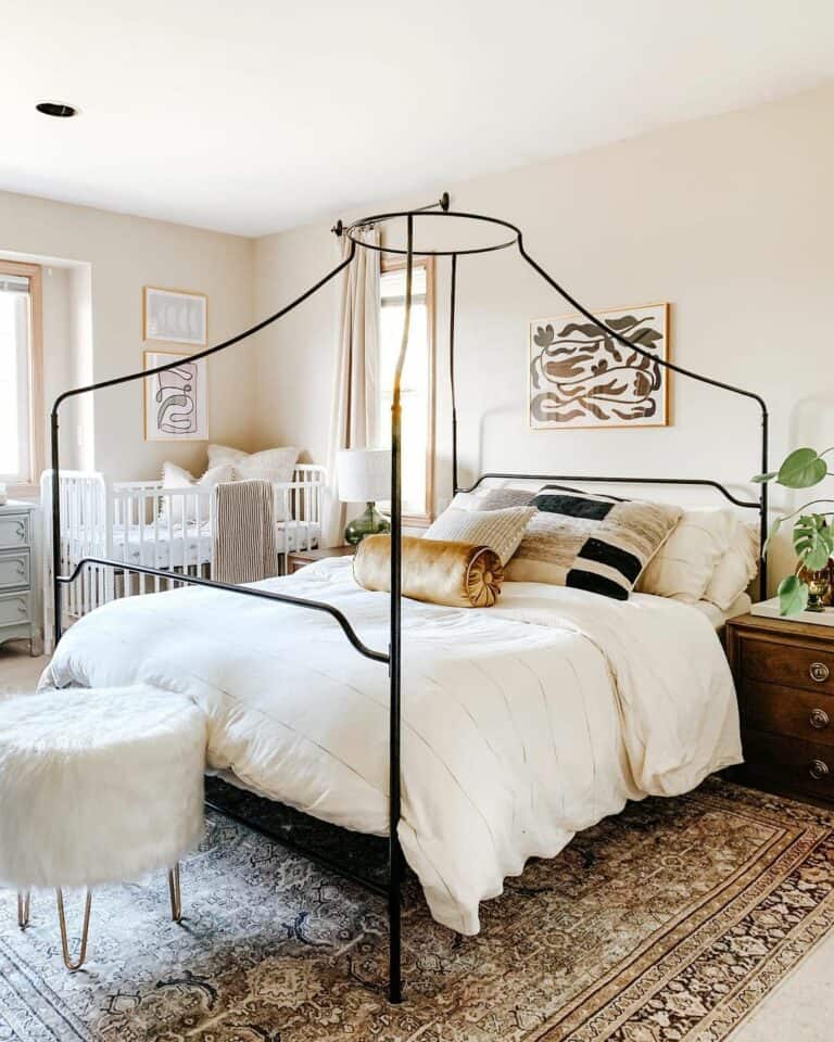 Bedroom With Black Metal Canopy Bed