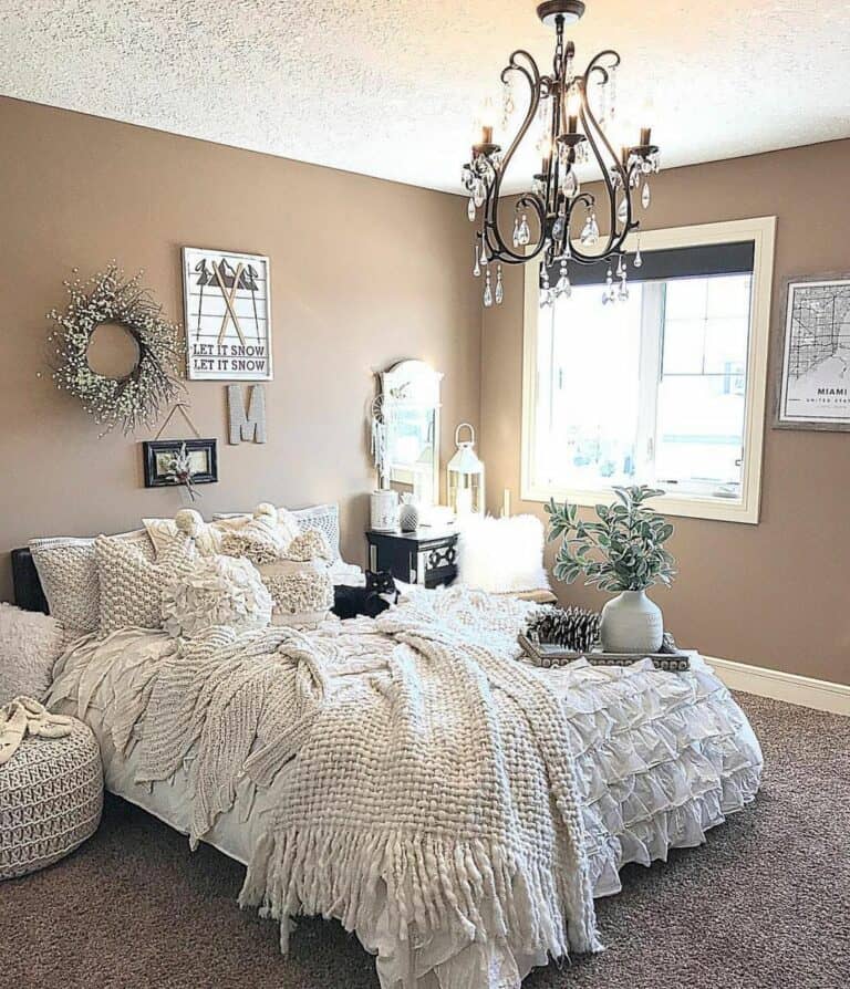 Bedroom With Black Metal and Crystal Chandelier