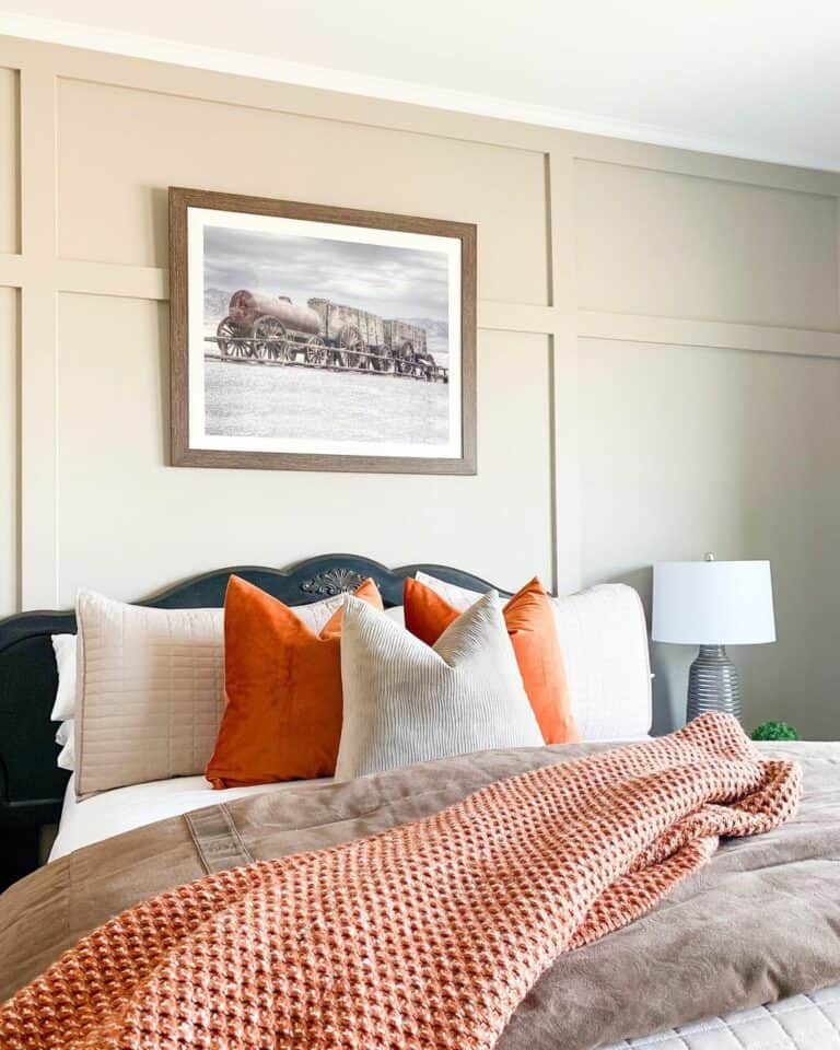 Beige Board and Batten Bedroom With Orange Accents