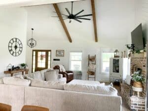 Beige Sectional Before a Brick Fireplace