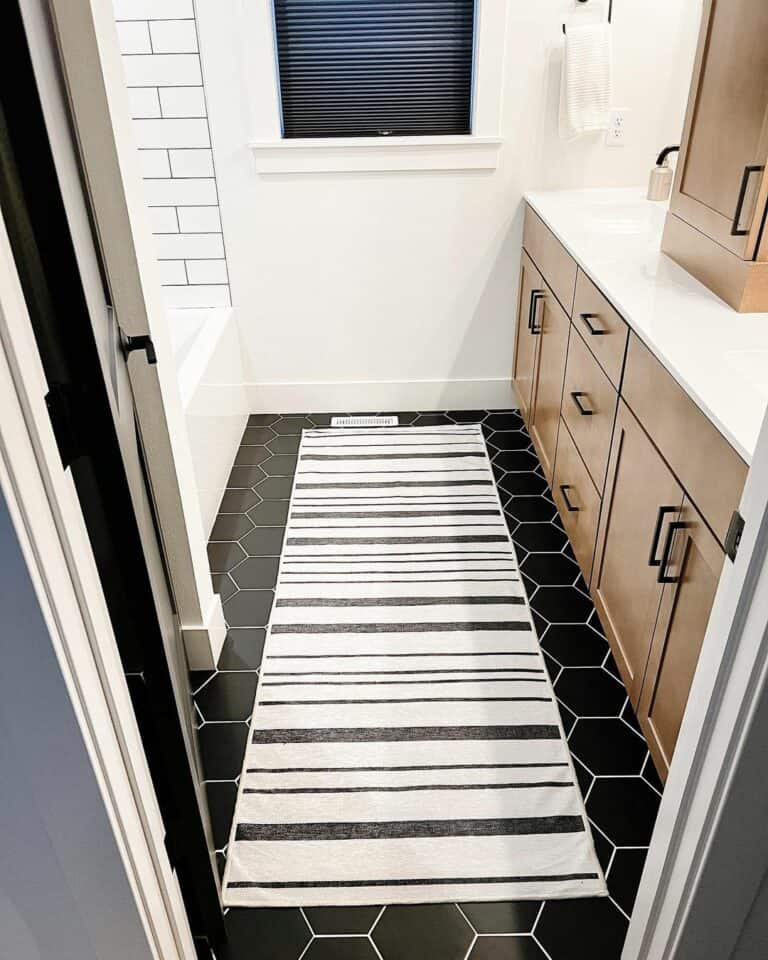 Black Hexagon Tile Bathroom Floor With Runner Rug
