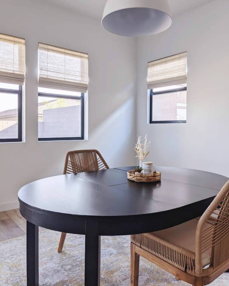 Black Wood Oval Dining Table With Woven Chairs