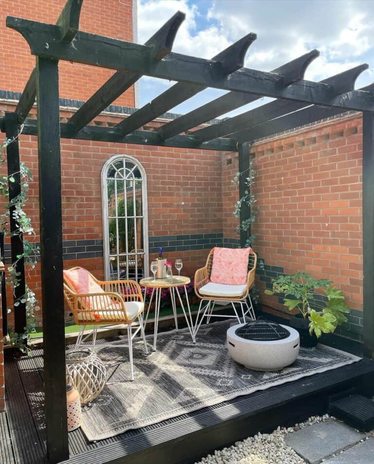 Brick House With Black Stained Wood Pergola