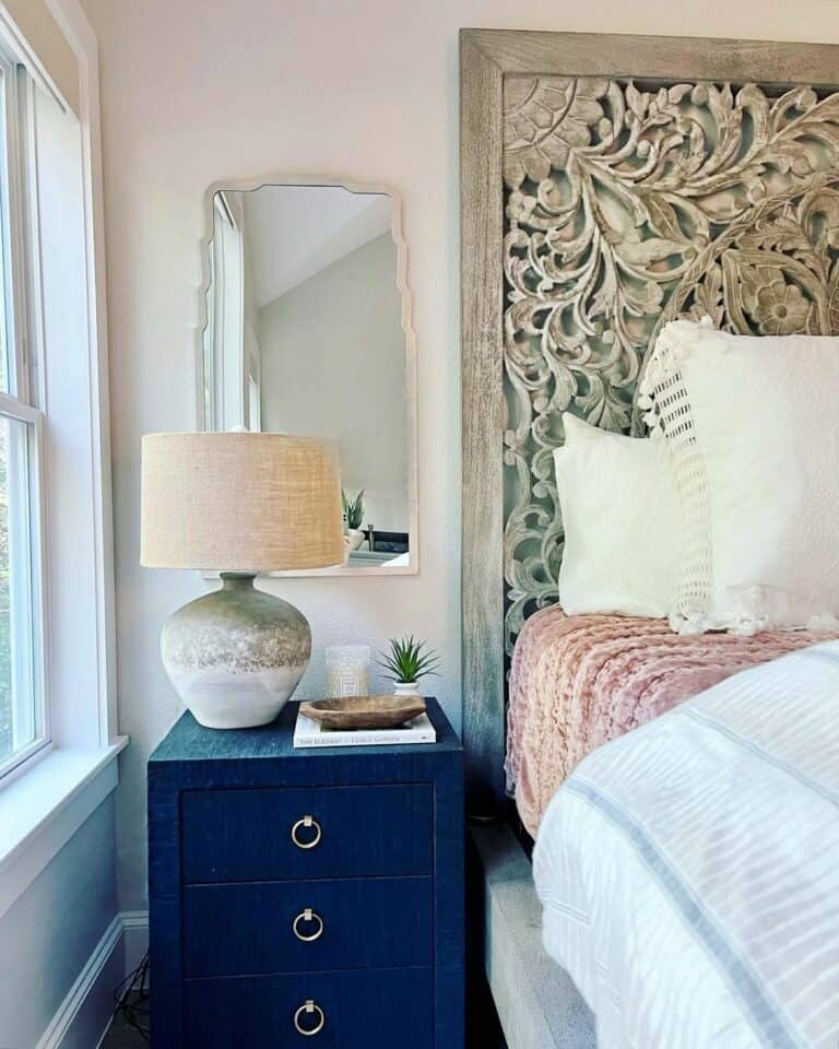Carved Headboard Against a Textured Wall