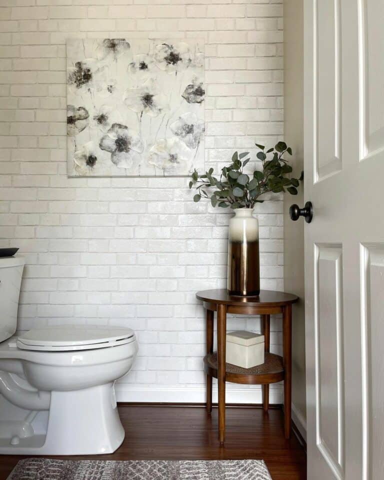 Cozy Modern Guest Bathroom With a White Brick Accent Wall