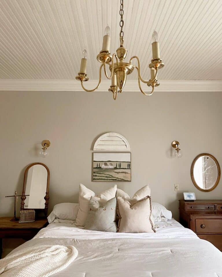 Cream Beadboard Ceiling With Brass Chandelier in Bedroom