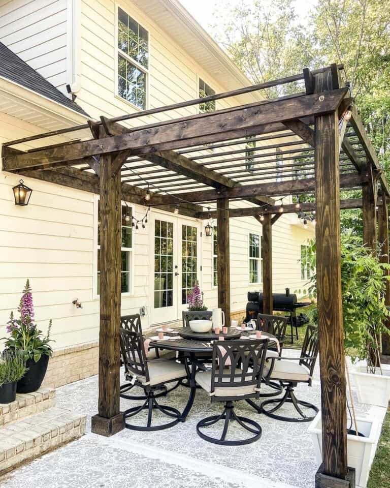 Dark Wood Patio Awning With Black Dining Set