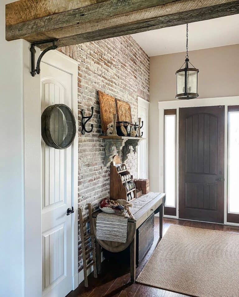Entryway Featuring Exposed Brick Accent Wall