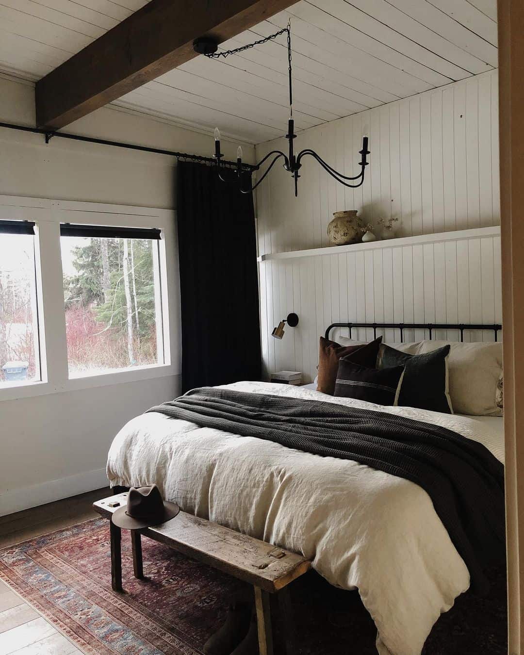 Farmhouse Bedroom Illuminated by Black Chandelier - Soul & Lane